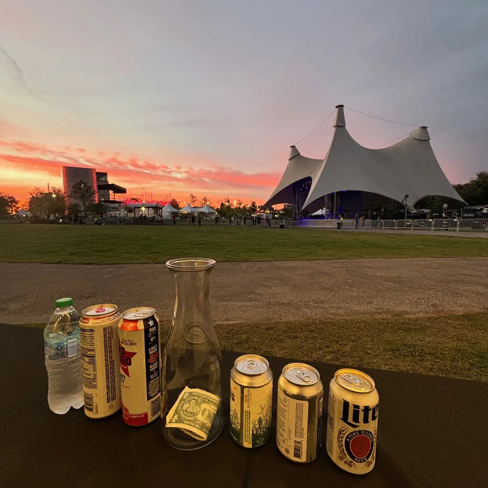 A festival tent at sunset with the bar set up in the foreground