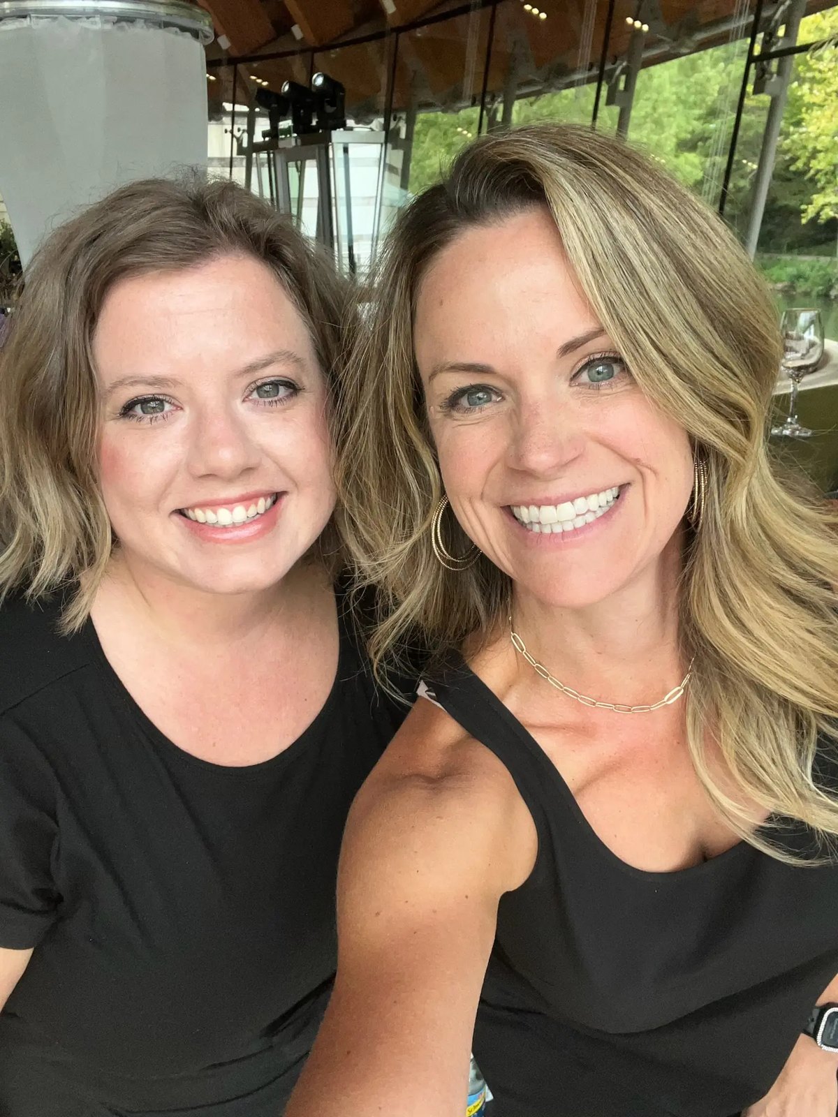 Two smiling Tie 1 On bartenders in black